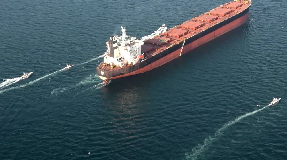 This handout photo released by Iran's Revolutionary Guards Corps (IRGC)'s official website Sepanews on February 17, 2026, shows boats maneuvering around a tanker vessel during a military exercise by members of the IRGC and navy in the Strait of Hormuz. (Sepahnews / AFP)