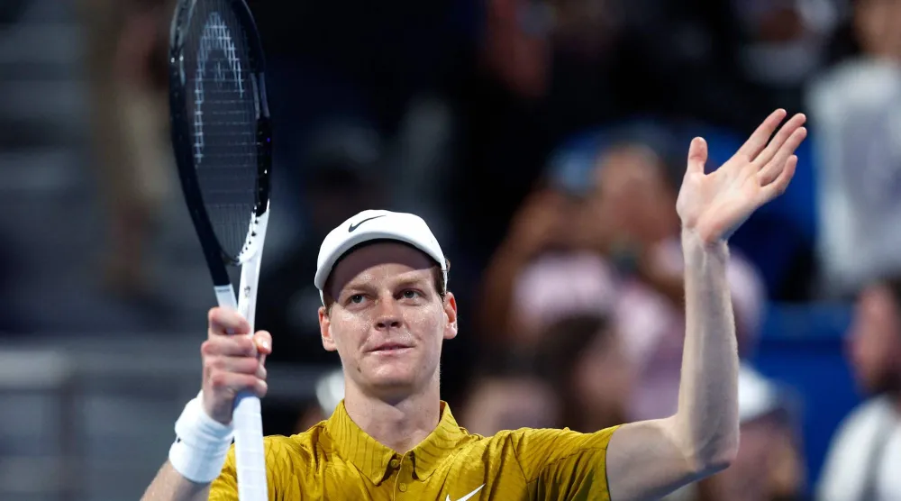  Italy's Jannik Sinner greets the fans after defeating Australia's Alexei Popyrin in their men's singles match at the Qatar Open tennis tournament in Doha on February 18, 2026. (AFP)