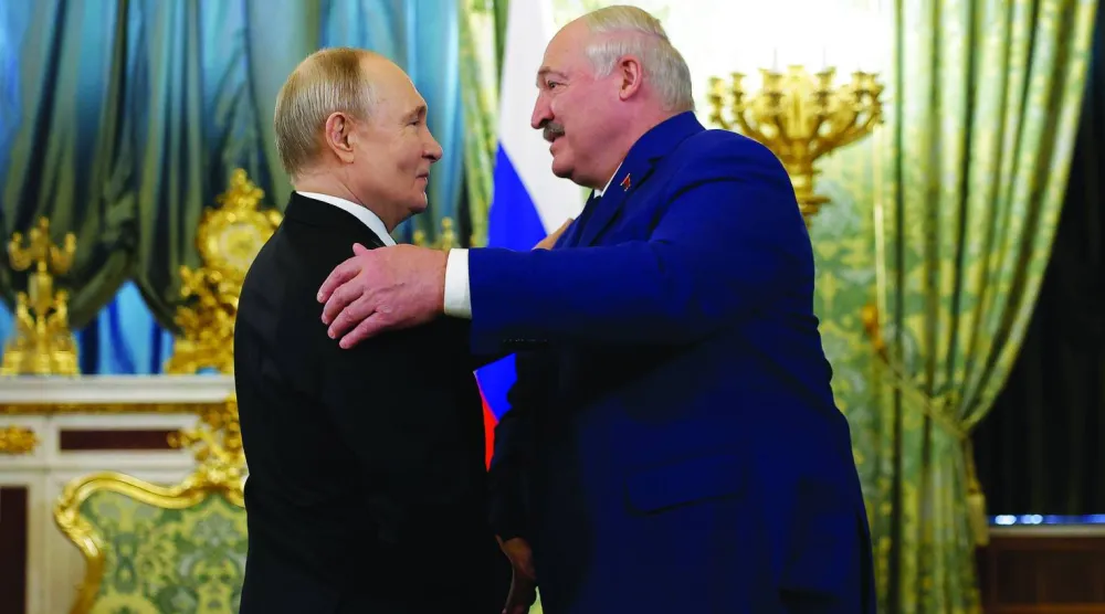 أرشيفية لبوتين مع نظيره البيلاروسي ألكسندر لوكاشينكو في موسكو (أ.ب)