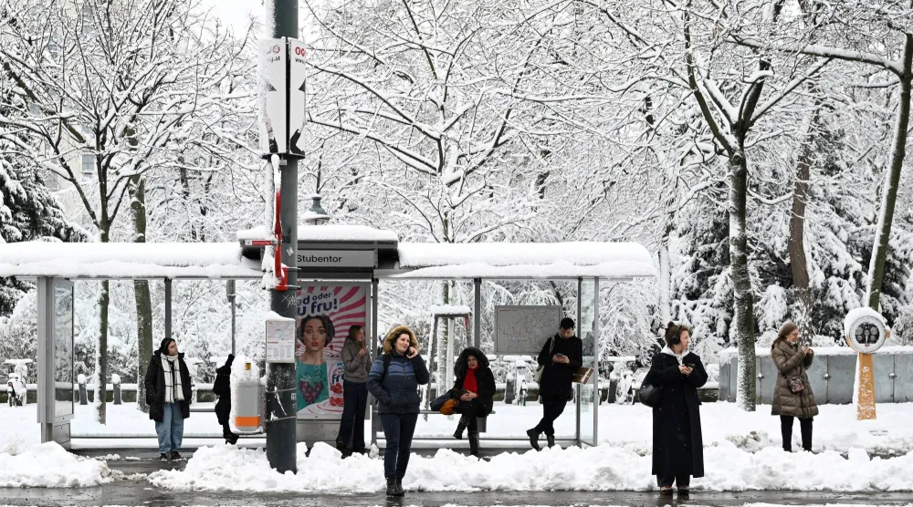People wait at a tram stop after heavy snowfalls in Vienna, Austria, February 20, 2026. REUTERS/Elisabeth Mandl