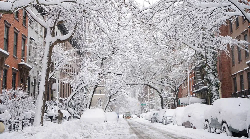 A snow plow crosses Second Avenue and heads down 19th Street to clear it after a snowstorm, Monday, Feb. 23, 2026, in New York. (AP)
