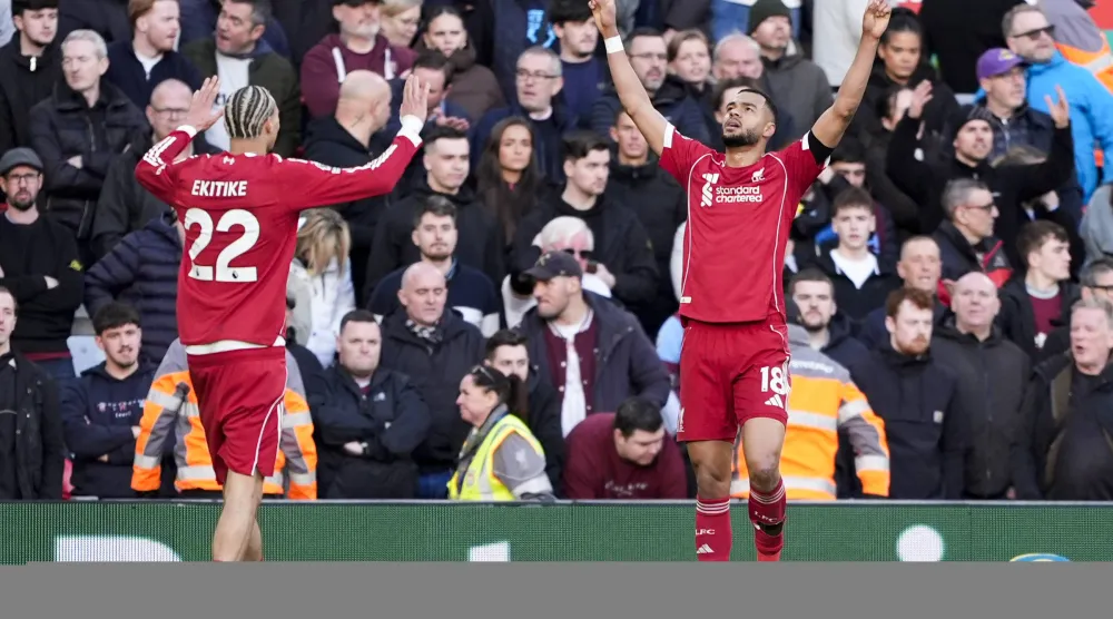 28 February 2026, United Kingdom, Liverpool: Liverpool's Cody Gakpo celebrates scoring his sides fourth goal during the English Premier League soccer match between Liverpool and West Ham United at Anfield. Photo: Peter Byrne/PA Wire/dpa