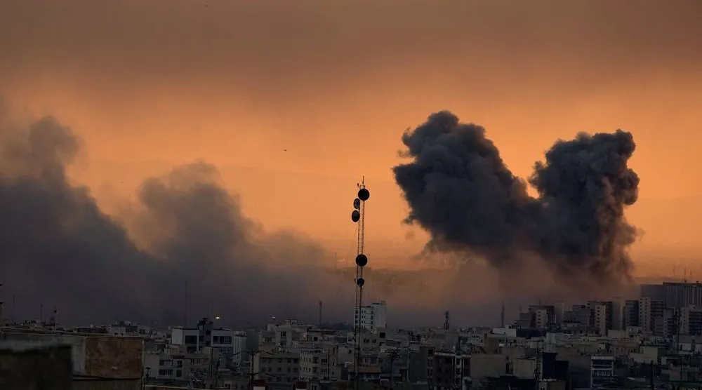  A plume of smoke rises following a US-Israeli military strike in Tehran, Iran, Tuesday, March 3, 2026. (AP) 
