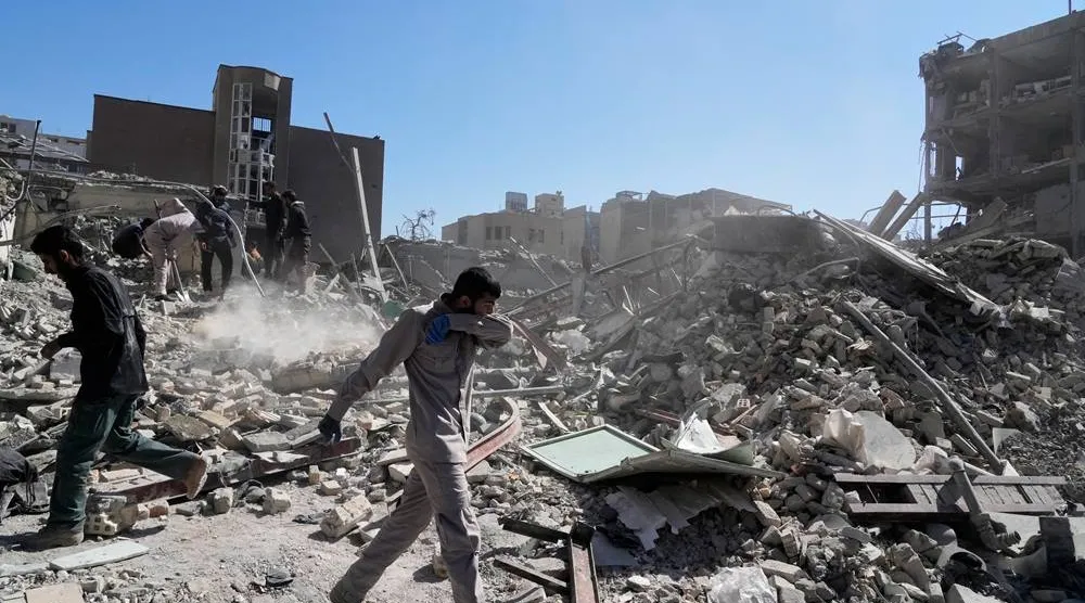  A group of men inspect the ruins of a police station struck Monday amid the US–Israeli military campaign in Tehran, Iran, Tuesday, March 3, 2026. (AP) 
