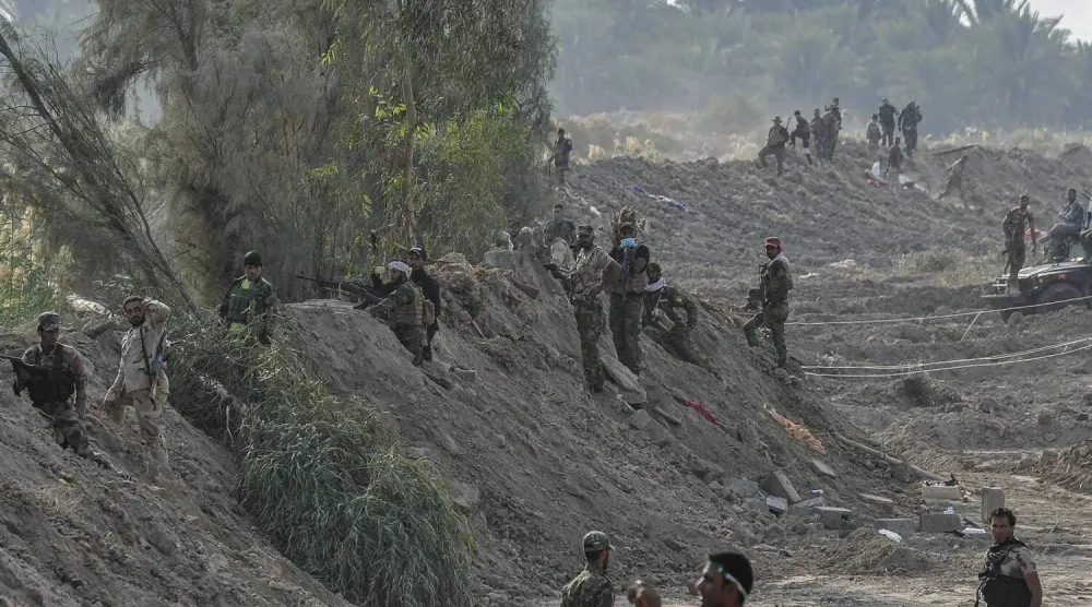 Halk Seferberlik Güçleri tarafından 2014 yılında yayınlanan ve Bağdat'ın güneyindeki Jurf el-Sakhr kasabasında üyelerini gösteren bir fotoğraf.