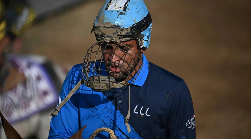 A cowboy gestures during a bull-tailing competition held as part of the "Fiestas del Alma Llanera" celebration in San Fernando de Apure, Apure State, Venezuela, on February 27, 2026. (AFP)