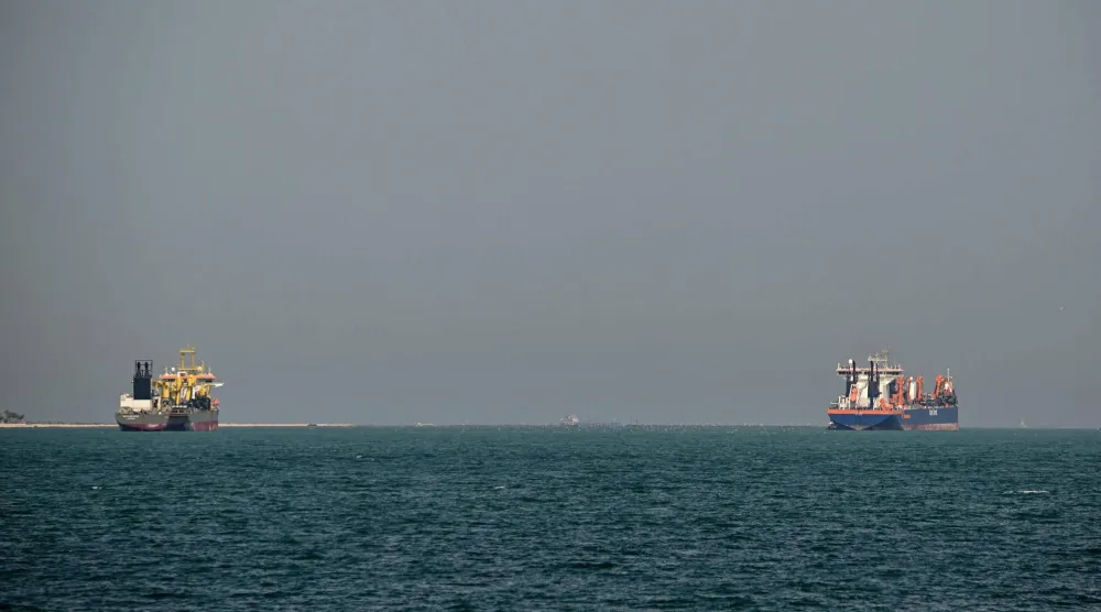 Commercial vessels are pictured offshore in Dubai on March 11, 2026. (AFP)