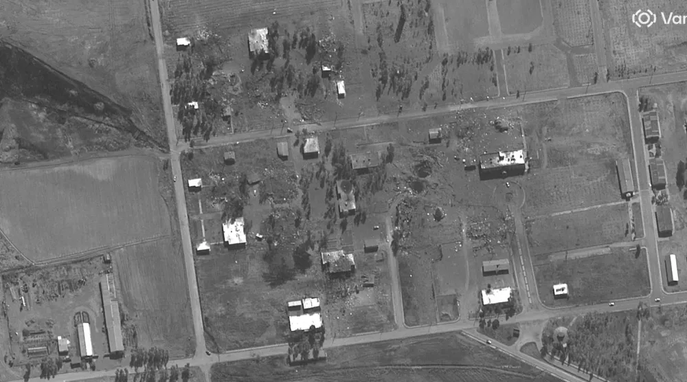 This satellite image taken and released on March 11, 2026 courtesy of Vantor shows a view of damaged buildings after airstrikes at Hakimabad garrison, some 30 kms (20 miles) south of Tehran, Iran. MANDATORY CREDIT "AFP PHOTO / Satellite image 2026 Vantor