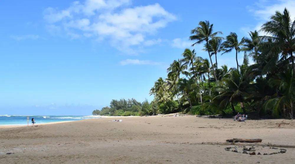 People spend time at Ha‘ena Beach Park, Monday, March 2, 2026, in Haena, Hawaii. (Noelle Fujii-Oride/Hawaii Civil Beat via AP)