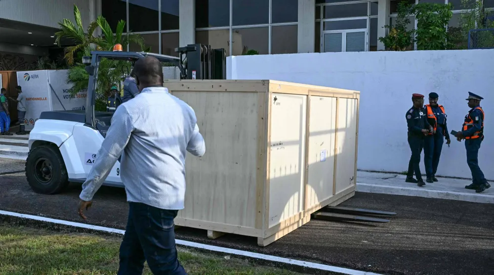A crate containing the Djidji Ayokwe drum, at the airport in Abidjan, Ivory Coast. (Photo by Issouf SANOGO / AFP)