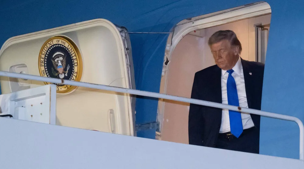 US President Donald Trump steps off Air Force One as he arrives at Palm Beach International Airport in West Palm Beach, Florida on March 13, 2026. (Photo by SAUL LOEB / AFP)