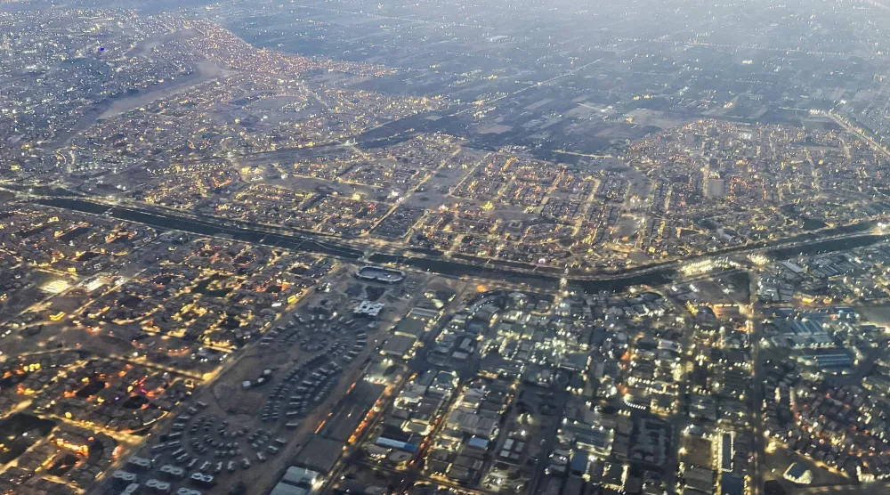 An aerial view shows Cairo's traffic with buildings and houses, through the window of a Turkish Airlines plane, in Cairo, Egypt March 12, 2026. REUTERS/Amr Abdallah Dalsh