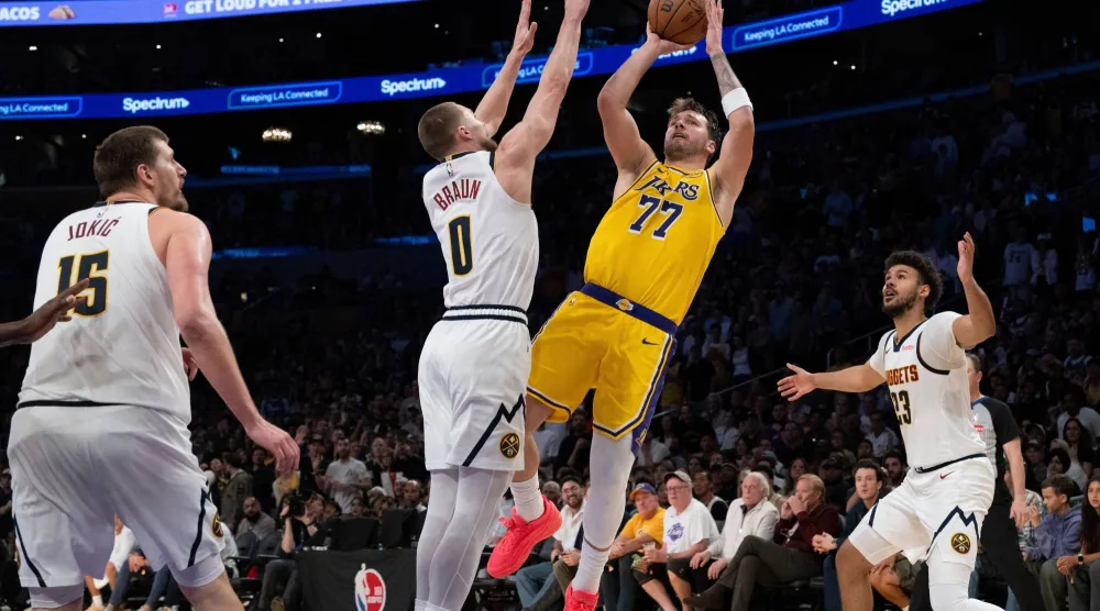 حقّق دونتشيتش متصدر هدافي الدوري 3 أرقام مزدوجة (أ.ب)