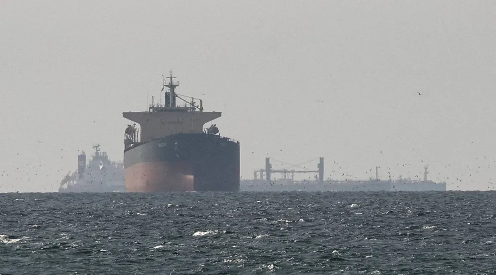 FILE PHOTO: Tankers sail in the Gulf, near the Strait of Hormuz, as seen from northern Ras al-Khaimah, near the border with Oman’s Musandam governance, amid the US-Israeli conflict with Iran, in United Arab Emirates, March 11, 2026. REUTERS/Stringer//File Photo