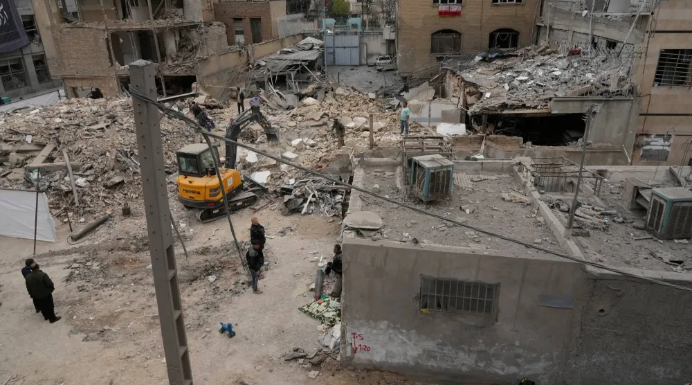 Destroyed buildings of a police station and nearby houses are seen after Friday's US-Israeli strike in Tehran, Iran, Sunday, March 15, 2026. (AP Photo/Vahid Salemi)