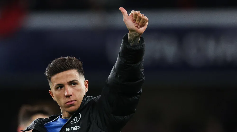 Chelsea's Argentinian midfielder #08 Enzo Fernandez gives a thumb up at the end of the UEFA Champions League round of 16 second leg football match between Chelsea FC and Paris Saint-Germain (PSG) at Stamford Bridge, west London on March 17, 2026. (Photo by Adrian Dennis / AFP)