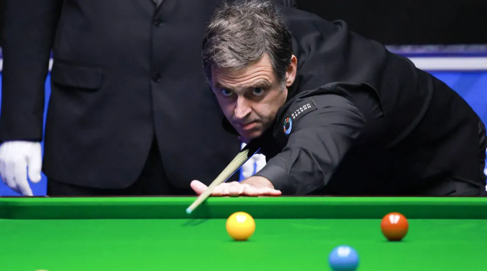 أوسوليفان خلال مباراته أمام مواطنه ريان دي (أ.ف.ب)