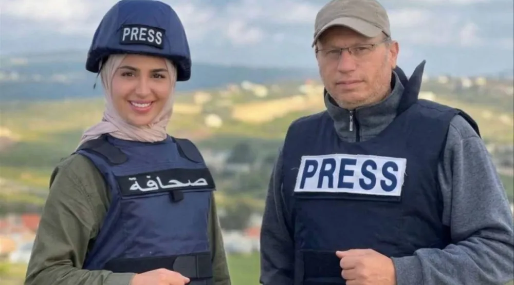 الإعلاميان علي شعيب وفاطمة فتوني (الوكالة الوطنية للإعلام)