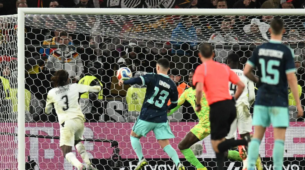 دنيز أونداف لحظة تسجيله هدف الفوز لألمانيا على ضيفتها غانا (أ.ف.ب)