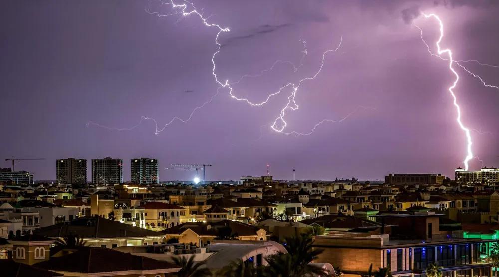 Lightning illuminates the sky over Dubai during a thunderstorm on March 26, 2026. (Photo by FADEL SENNA / AFP)