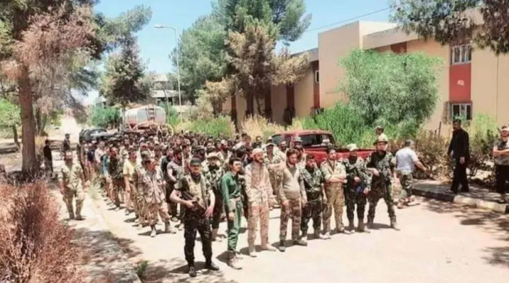 مرتزقة سوريون خلال مظاهرة للمطالبة برواتبهم المتأخرة في طرابلس قبل 4 أعوام (لقطة من تسجيل مصور)