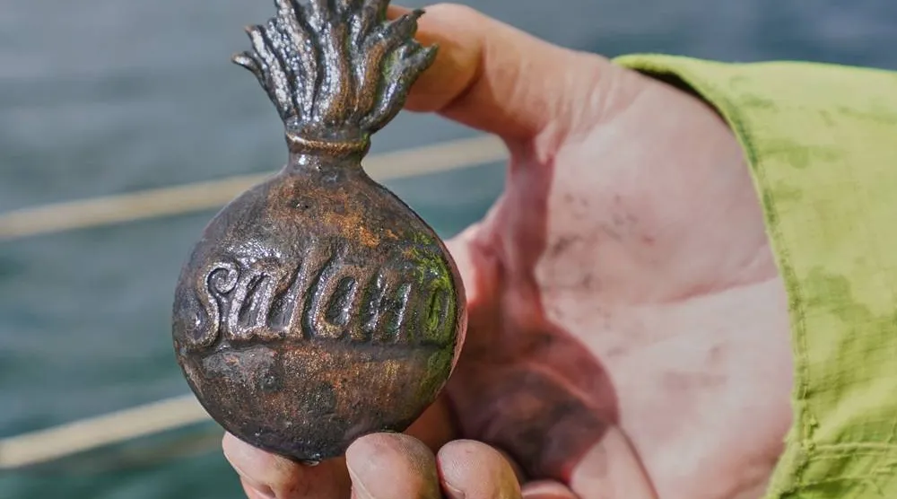  Morten Johansen, head of maritime archaeology at Denmark's Viking Ship Museum, shows a metal insignia recovered from the wreck of Danish flagship "Dannebroge" that sank during the Battle of Copenhagen in 1801, in Copenhagen, Denmark, Tuesday, March 31, 2026. (AP)