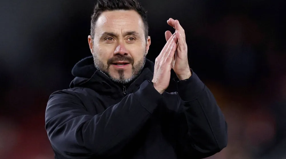 Football - Premier League - Brentford v Brighton & Hove Albion - Brentford Community Stadium, London, Britain - April 3, 2024 Brighton & Hove Albion manager Roberto De Zerbi applauds fans after the match. (Action Images via Reuters)