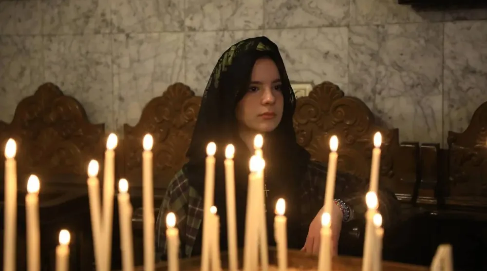  A Palestinian Christian woman attends a service at Saint Porphyrius Church in Gaza on Sunday (dpa). 
