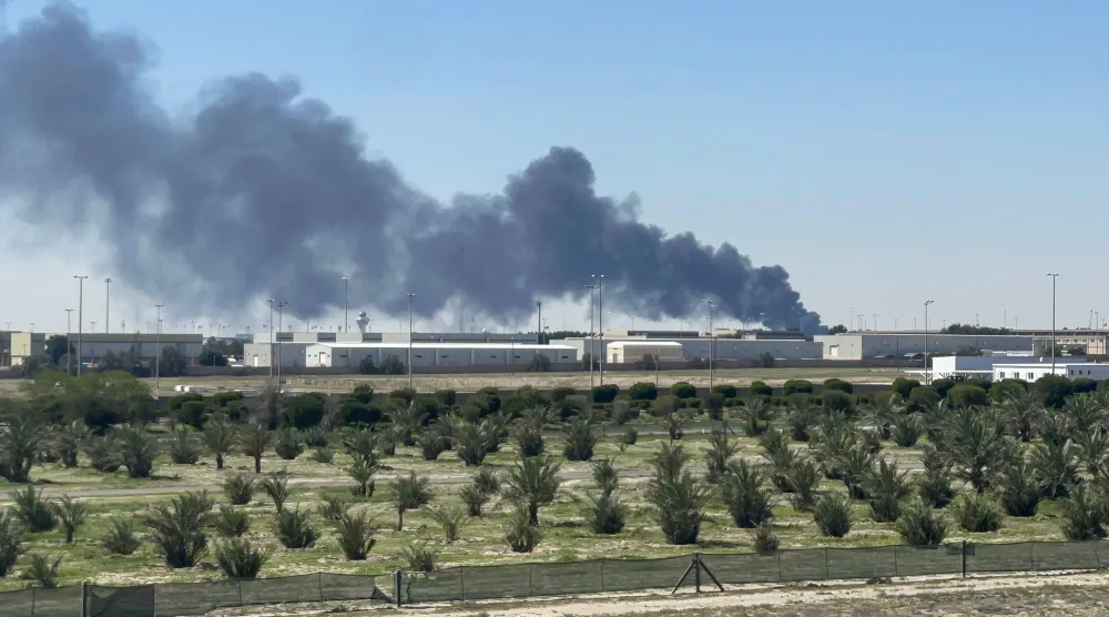 Smoke rises from an area of Kuwait's international airport after a reported drone strike on April 1, 2026. (Photo by AFP)