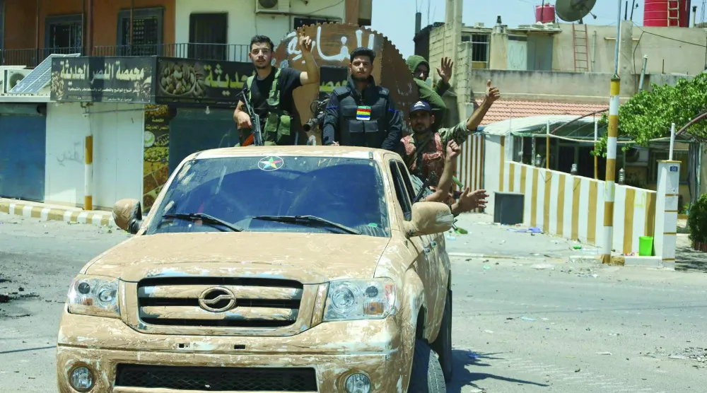 عناصر من المسلحين الدروز الموالين للشيح الهجري خلال دورية في السويداء (أرشيفية - أ.ف.ب)