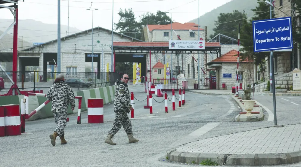 Lebanese General Security members stand guard at the Masnaa border crossing with Syria in the Bekaa Valley, eastern Lebanon, 05 April 2026, following an Israeli warning to target the M30 highway between Lebanon and Syria. (EPA)