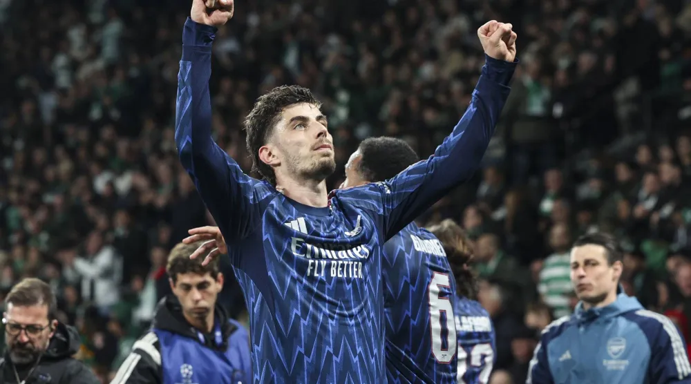 الألماني كاي هافيرتز يحتفل بهدفه في مرمى سبورتنغ (إ.ب.أ)