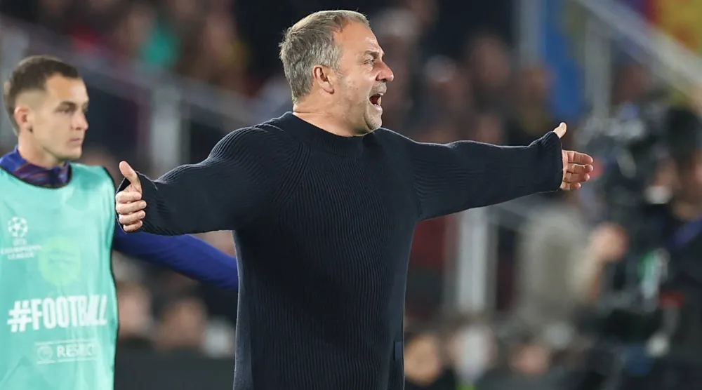 فليك متفاعلا مع أحداث المباراة (أ.ف.ب)