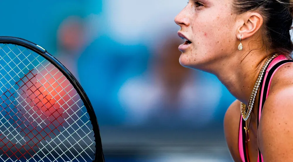 MIAMI GARDENS, FLORIDA - MARCH 28: Aryna Sabalenka returns a shot against Coco Gauff of the United States during the Women's Singles Final on Day 12 of the Miami Open Presented by Itau at Hard Rock Stadium on March 28, 2026 in Miami Gardens, Florida.   Carmen Mandato/Getty Images/AFP 