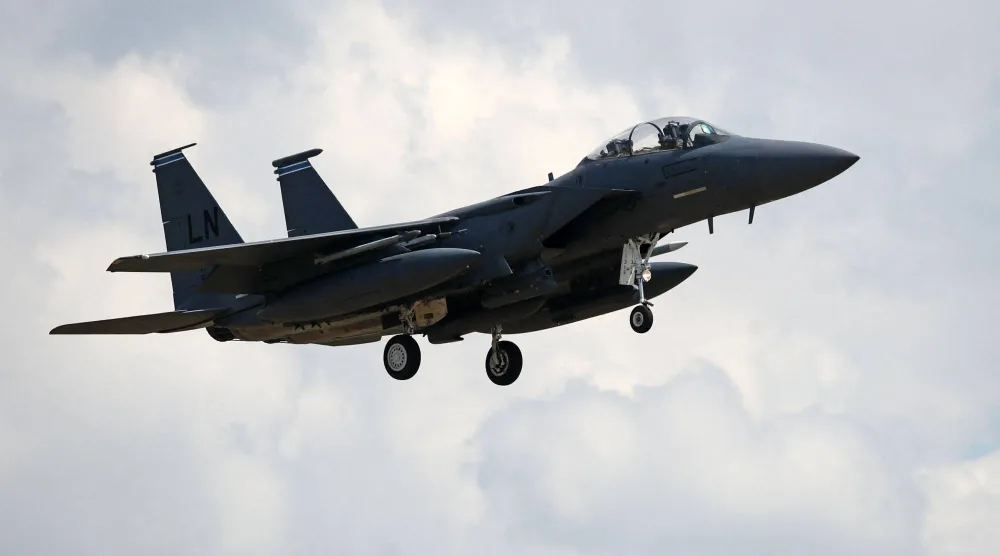 (FILES) A US Air Force (USAF) F-15E Eagle fighter jet, is pictured as it prepares to land at RAF (Royal Air Force) Lakenheath, east of England, on June 15, 2020. (Photo by CHRIS RADBURN / AFP)