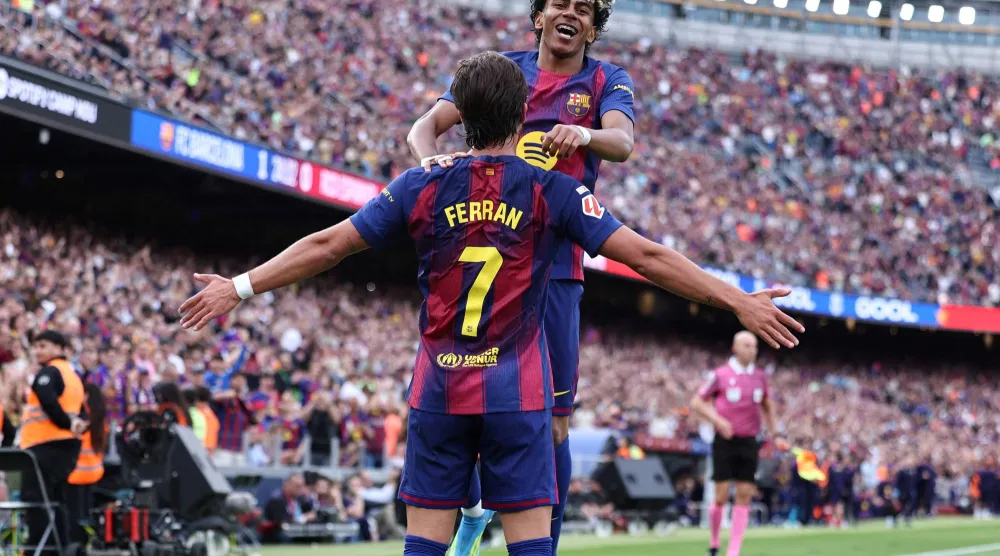 جمال يحتفل بهدفه في إسبانيول (أ.ف.ب)