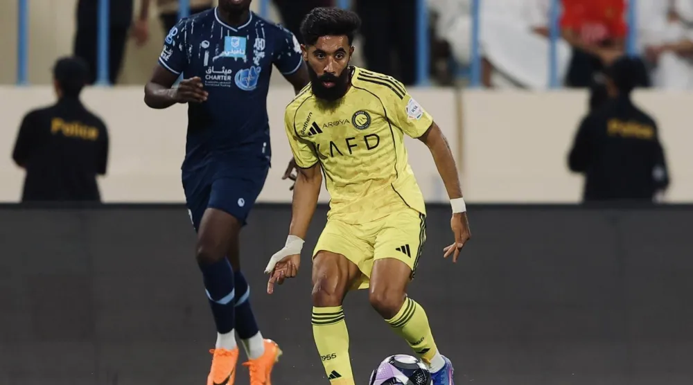 نواف بوشل خلال المواجهة أمام الأخدود (موقع النادي)