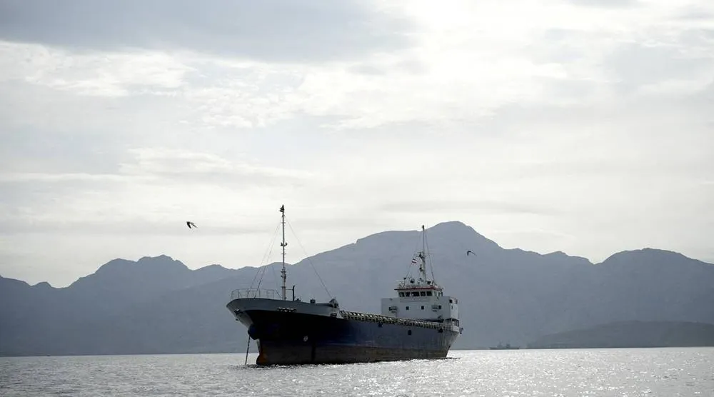 A vessel in the Strait of Hormuz, off the coast of Oman’s Musandam province, April 12, 2026. (Reuters)