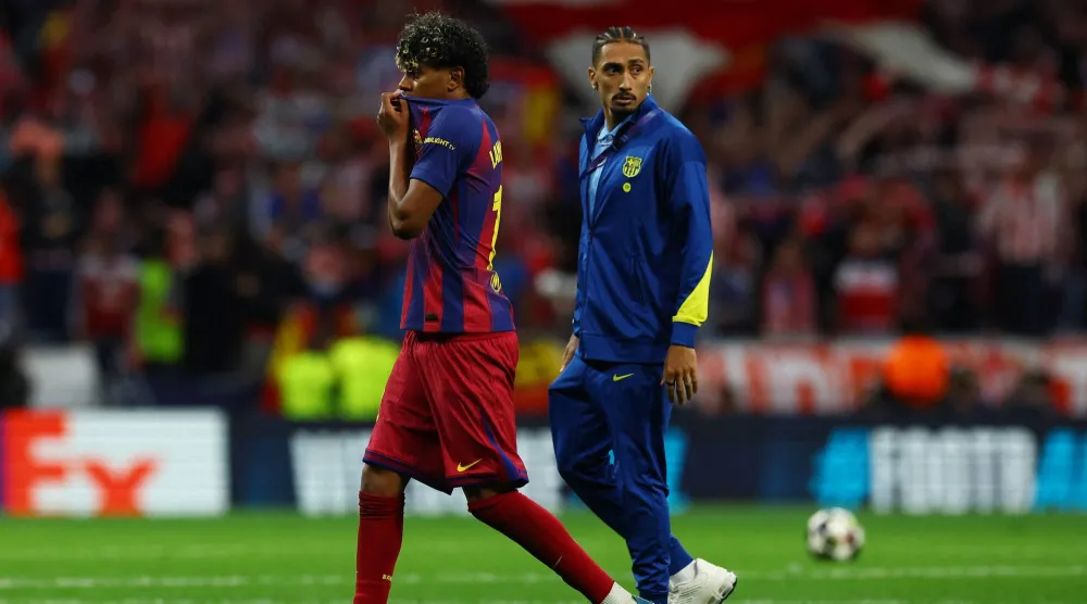 Football - UEFA Champions League - Quarter-Final - Second Leg - Atletico Madrid v FC Barcelona - Riyadh Air Metropolitano, Madrid, Spain - April 14, 2026 FC Barcelona's Lamine Yamal and Raphinha look dejected after the match. (Reuters) 