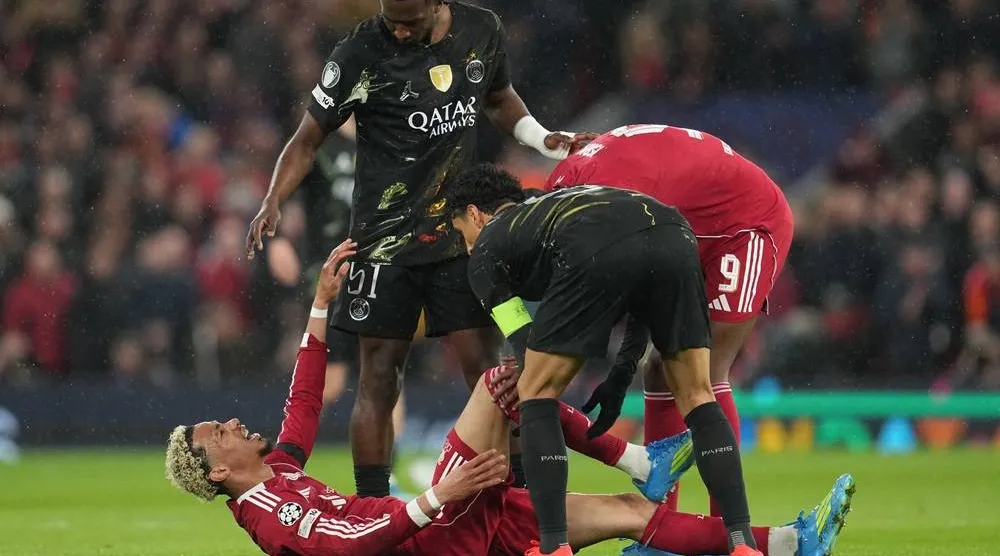  Liverpool's Hugo Ekitike lies injured during the Champions League quarterfinal second leg soccer match between Liverpool and Paris Saint-Germain in Liverpool, England, Tuesday, April 14, 2026. (AP) 