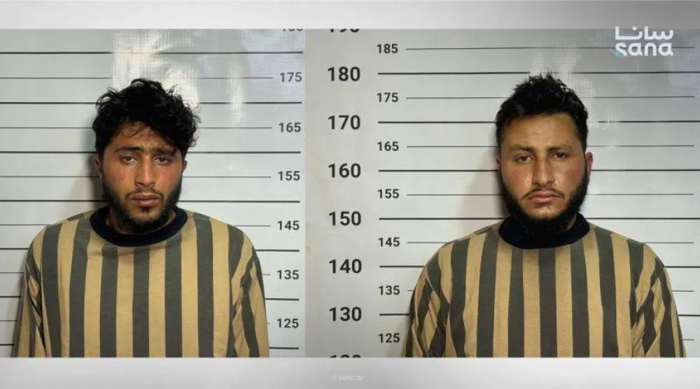 صورة وزعتها وزارة الداخلية لعنصرَي «داعش» (سانا)
