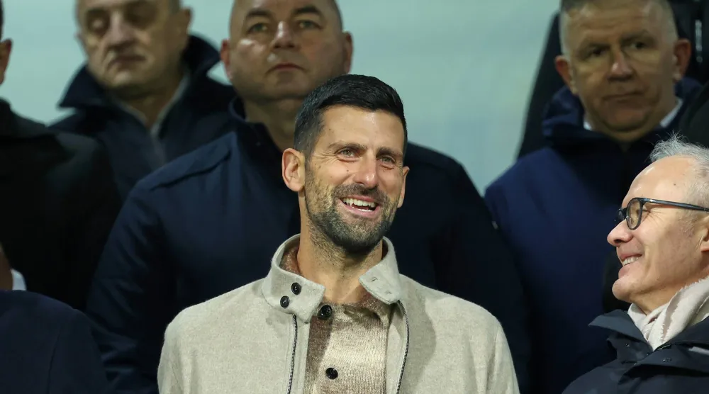 Tennis star Novak Djokovic takes his place in the stands for the World Cup qualifying playoff final soccer match between Bosnia and Italy in Zenica, Bosnia, Tuesday, March 31, 2026. (AP Photo/Armin Durgut)