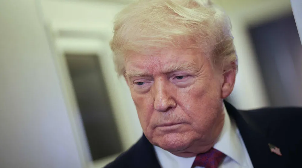 IN FLIGHT - APRIL 17: US President Donald Trump speaks to members of the press aboard Air Force One on April 17, 2026 just prior to landing at Joint Base Andrews, Maryland. (Photo by WIN MCNAMEE / GETTY IMAGES NORTH AMERICA / Getty Images via AFP)