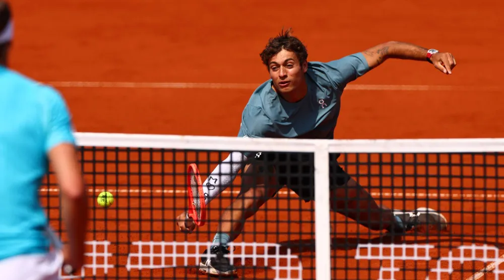 Flavio Cobolli of Italy in action during his semi-finals match against Alexander Zverev of Germany at the BMW Open tennis tournament in Munich, Germany, 18 April 2026.  EPA/ANNA SZILAGYI