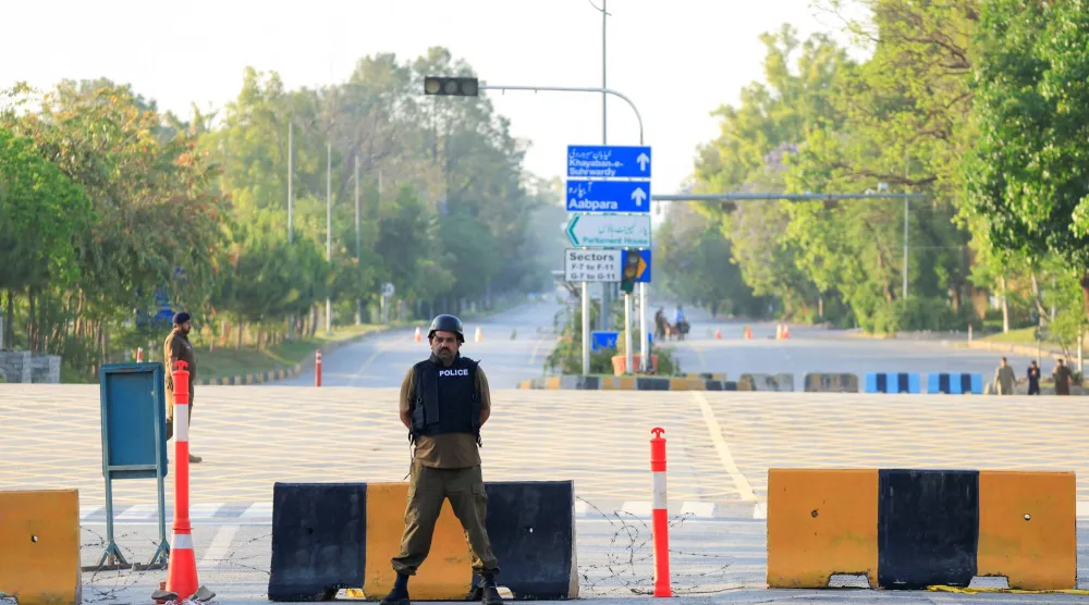  Police officers stand guard on a road leading to the Serena Hotel, as Pakistan prepares to host the US and Iran for the second phase of peace talks in Islamabad, Pakistan, April 21, 2026. (Reuters)