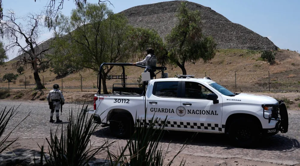 National Guard troops patrol the Teotihuacan pyramids, which remained closed a day after a gunman opened fire on tourists at the archaeological site outside Mexico City, Tuesday, April 21, 2026. (AP Photo/Marco Ugarte)
