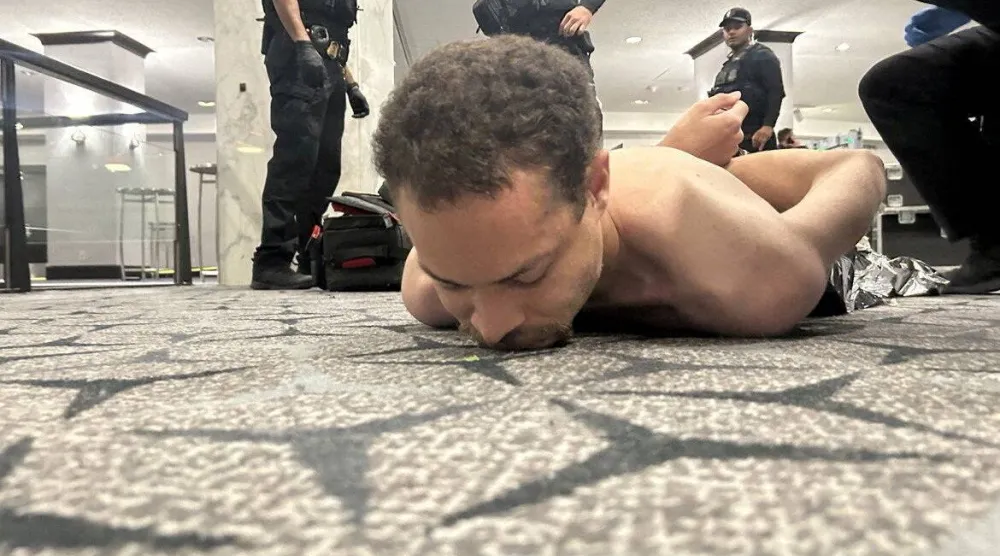 لحظة إلقاء القبض على كول توماس ألين من قبل قوات إنفاذ القانون الأميركية (رويترز)