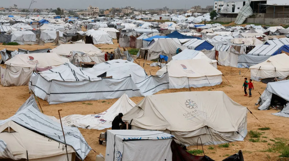 FILE PHOTO: Displaced Palestinians shelter in a tent camp on a windy day in Khan Younis in the southern Gaza Strip, April 2, 2026. REUTERS/Haseeb Alwazeer/File Photo