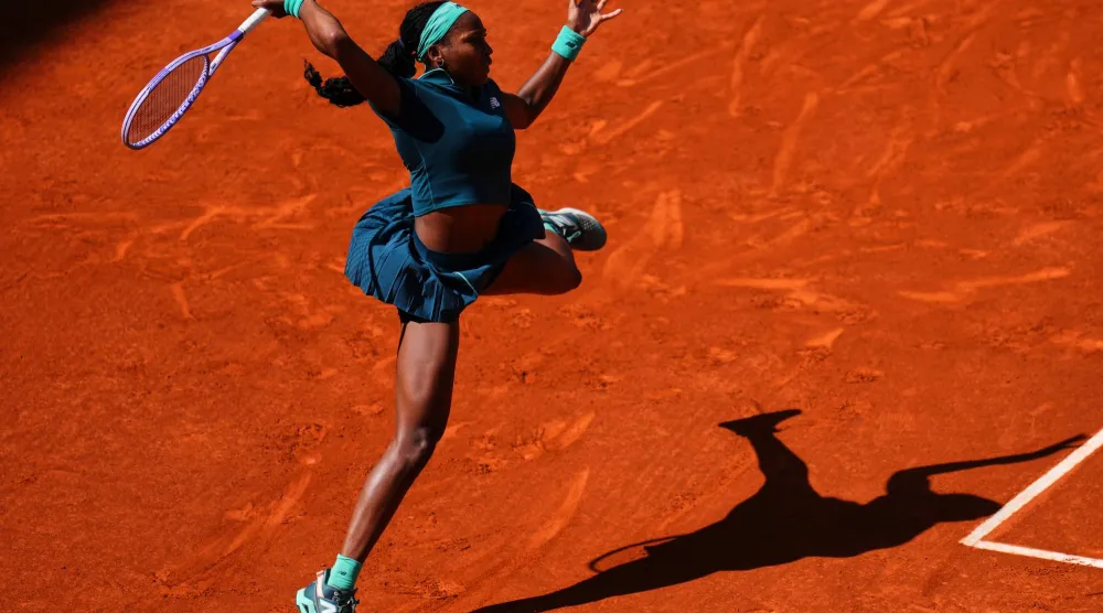 Coco Gauff of the US returns the ball to Sorana Cirstea of Romania during the Madrid Open tennis tournament in Madrid, Sunday, April 26, 2026. (AP Photo/Manu Fernandez)