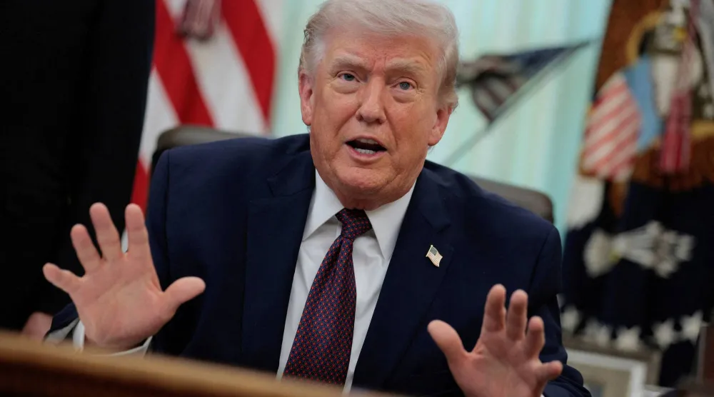FILE PHOTO: US President Donald Trump speaks during the signing ceremony for an executive order on mail ballots, in the Oval Office of the White House in Washington, D.C., March 31, 2026.  REUTERS/Evan Vucci/File Photo